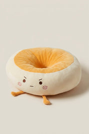 Coussin japonais 'Itami' expression aux yeux ronds — coussin de sol en peluche crème en forme de personnage à joues roses, centre orange et petits pieds