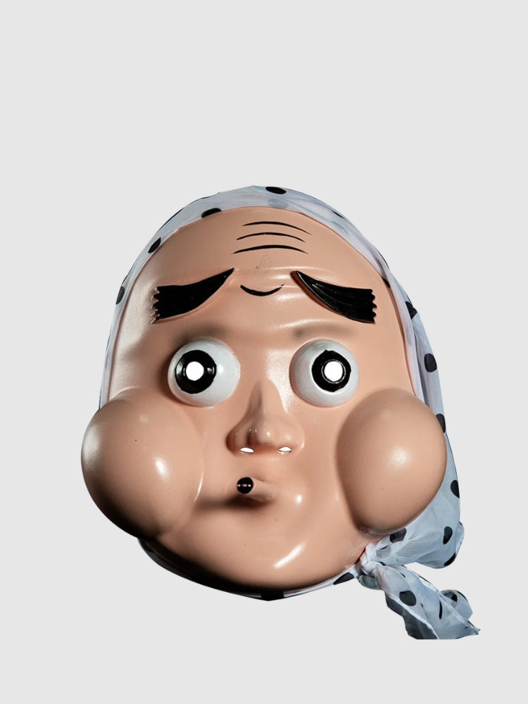 Masque hyottoko présenté de face sur fond gris uni — visage comique aux joues rondes, bouche pincée de travers et bandeau bleu
