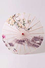 Ombrelle japonaise 'No-Kodai' vue de dessus, ouverte à plat — toile crème à branche fleurie rose peinte en réserve, baleines rayonnant depuis le moyeu