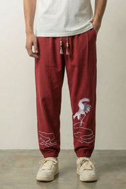 Pantalon japonais Tsuru rouge bordeaux à broderie de grue blanche sur le mollet Japanstreet