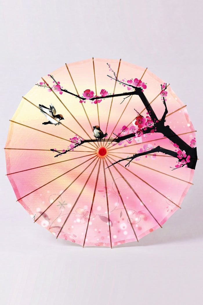 Ombrelle japonaise 'Sakura Fleuri' vue de dessous — toile rose dégradée à branche sombre et fleurs de cerisier, armature apparente