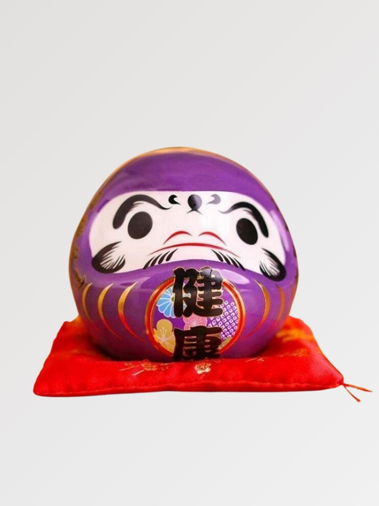 Daruma violet impérial à kanji 健康 kenkō (santé) pour vœu de longévité, tirelire porcelaine peinte main — vue principale de fa