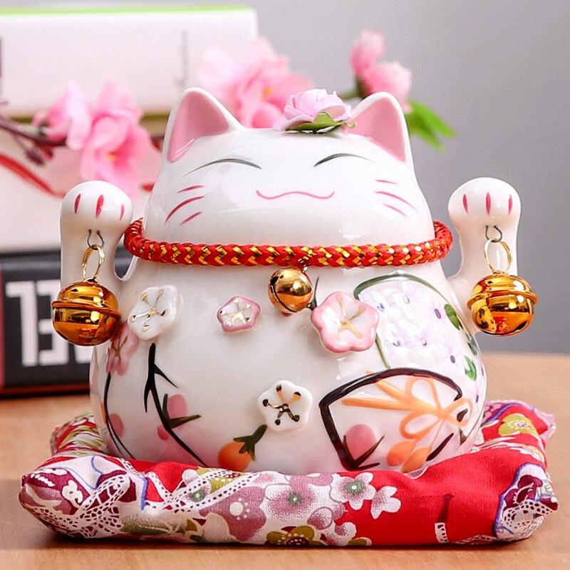 Maneki-neko tirelire à clochettes suzu multipliées pour protection shintō — vue de profil arrière — Japanstreet