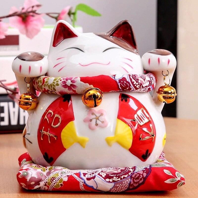 Maneki-neko tirelire à deux koban doublés et ruban festif rouge pour chance amplifiée — vue de profil arrière — Japanstreet