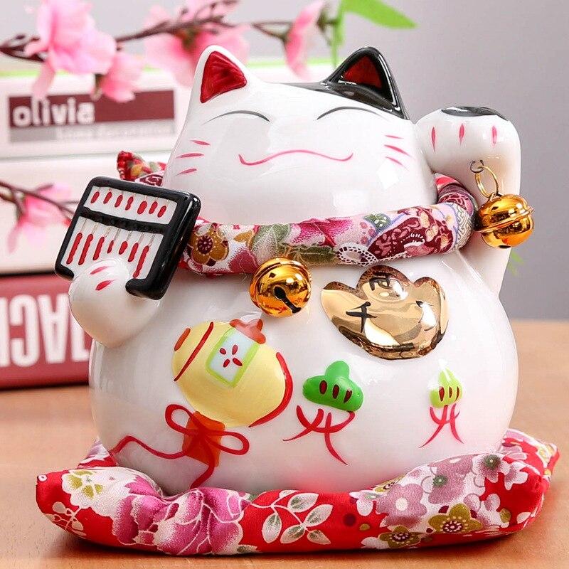Maneki-neko tirelire feng shui à deux pattes levées avec éventail et koban — vue de profil arrière — Japanstreet